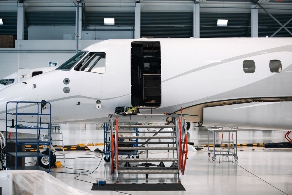 Private jet in hangar undergoing MRO work