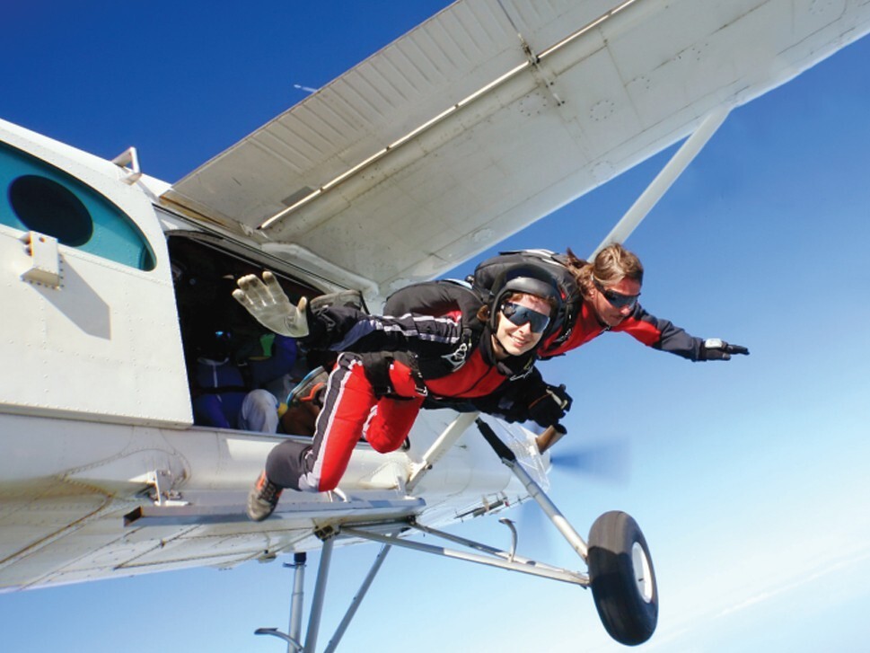 Skydiver jumping out of plane